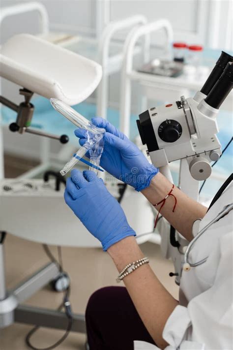 Speculum Close Up In Gynecologist Hands For Colposcopy Procedure To Closely Examine Cervix