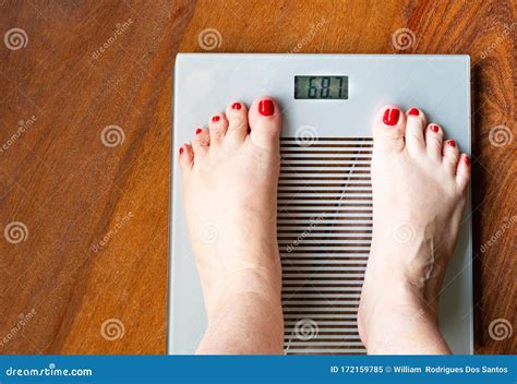 Feet Of A Woman Who Wants To Lose Weight On A Scale Stock Image Image