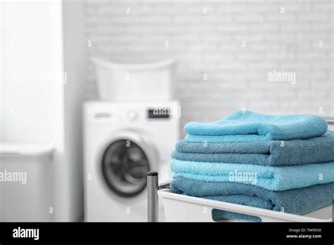 Stack Of Clean Towels On Cart In Laundromat Stock Photo Alamy