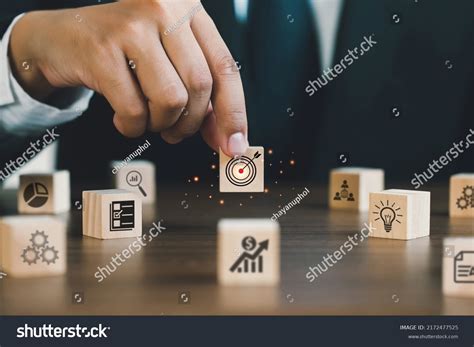 Businessman Hand Holding Wooden Block Target Stock Photo 2172477525