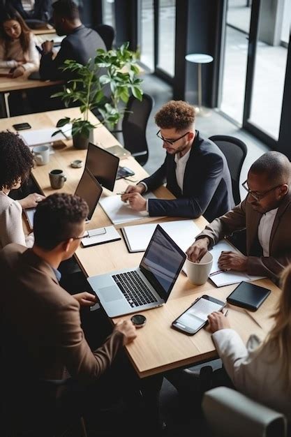 Premium Photo High Angle View Of Multiracial Business People Working