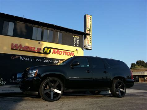 Chevy Suburban On 24 Dub Baller Wheels With A Black And Machine With