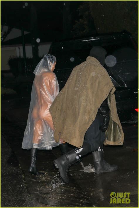 kanye wests wife bianca censori braves  rain    poncho