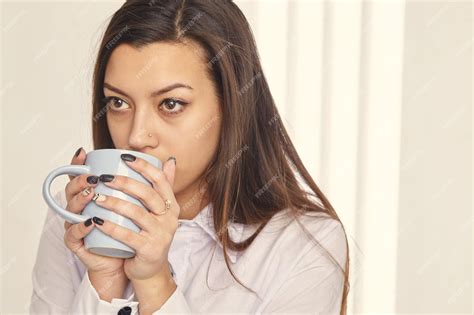 Premium Photo Candid Image Of A Businesswoman Drinking Coffee While