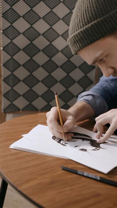 Young Boy Drawing on a Sketchbook · Free Stock Video