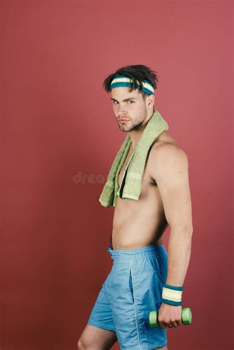 Sport And Slim Shape Concept Man With Naked Torso Holds Towel On Neck And Dumbbell Stock Image