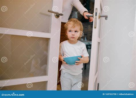 Little Kid Boy Stay Near The Door Holding Dish Stock Photo Image Of