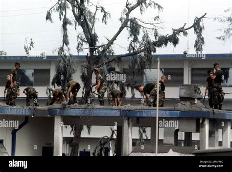 Marines Clear Off The Volcanic Ash Covering The Roof Of The Cubi Point