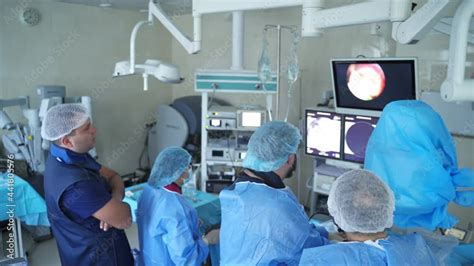 Endoscopic Surgery Team Of Medical Specialists Performing An Operation