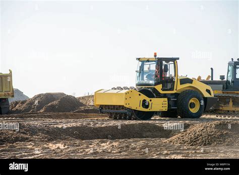 Heavy Duty Machinery Working On Highway Construction Site Bulldozer