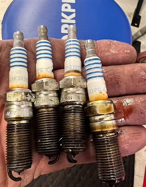 Understanding Causes And Solutions For Oil On Spark Plugs Threads