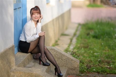 Asian Bokeh Sitting Brown Haired Smile Hands Blouse Skirt Legs