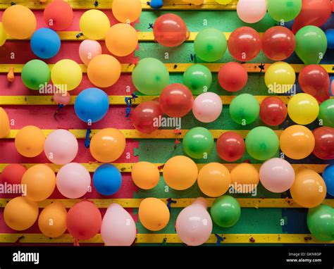 Balloons on a wall of an amusement park game Stock Photo - Alamy