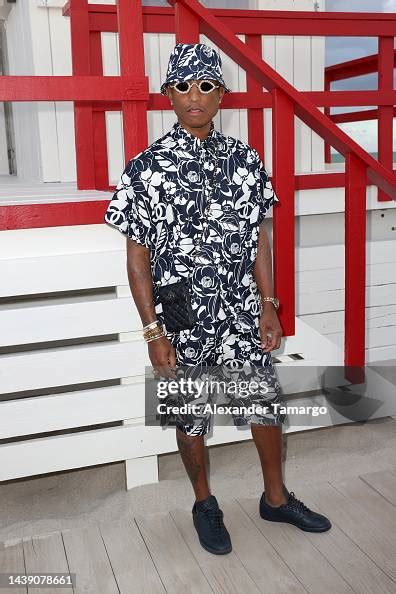 Pharrell Williams attends CHANEL Cruise 2022/23 Collection in Miami ...