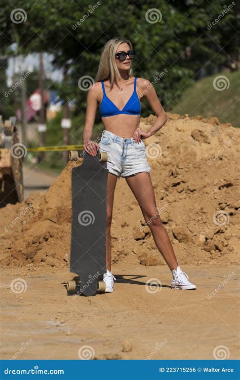 A Lovely Blonde Model Poses Outdoors In A Large City Environment Stock Photo Image Of