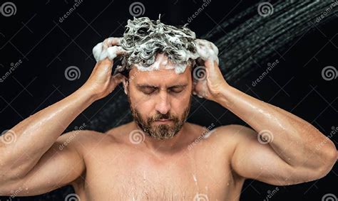 Millennial Man Washing Hair In Bath Guy Bathing Shower Head In Bathtub