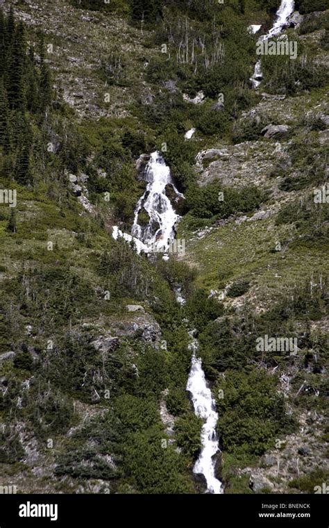 Waterfalls in the North Cascades National Park with blue skies located ...