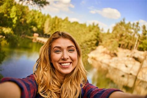 Female Tourist Exploring New Places Making A Selfie Photo Portrait Of