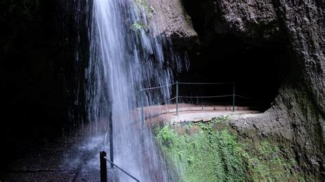 Amazing waterfall deep inside of the mountain. Tunnel, cave passage for