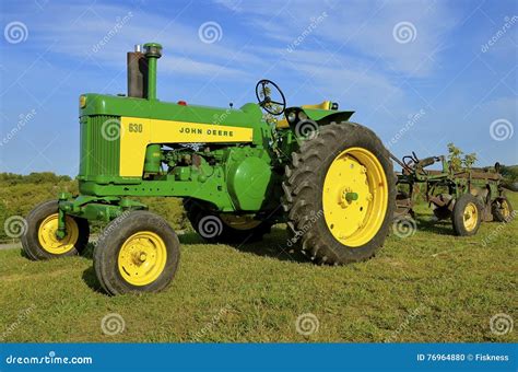 Restored John Deere Tractor And Trip Plow Editorial Image Image