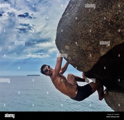 Climbing the rock Stock Photo - Alamy