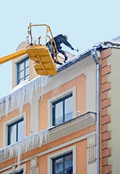 Workers Clean Snow And Icicle Stock Image Everypixel