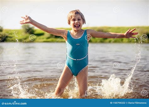 Girl swimming in river stock photo. Image of holiday - 150794322