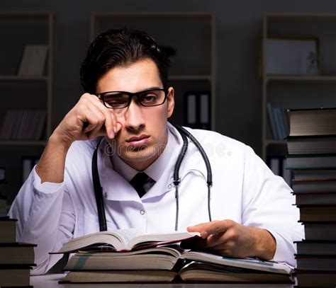 The Medical Student Preparing for University Exams at Night Stock Image ...