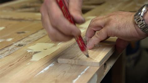 Man Working On Wood With Tools To Restores 100 Year Old Double Door