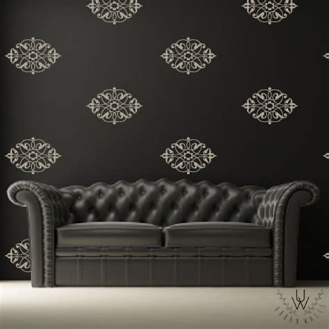 White Damask Wall Decals Placed Evenly As A Pattern On A Black Wall