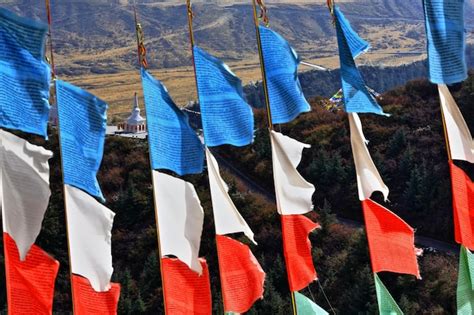 Premium Photo Multi Colored Flags Hanging Against Landscape