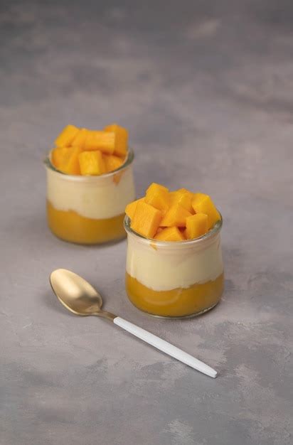 Premium Photo Italian Dessert Panna Cotta With Mango Jelly And Pieces