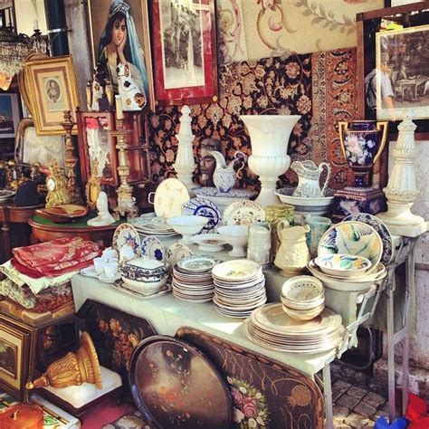 There Are Many Plates And Vases On Display In This Room Including One