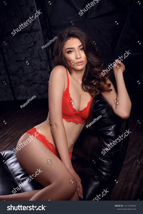 Sexy Brunette Red Lingerie Relaxes Dark Stock Photo 1213194502 Shutterstock
