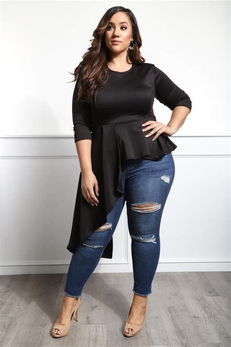 A Plus Size High Low Peplum Top Featuring A Flared Silhouette And Cascading Panel At The Side