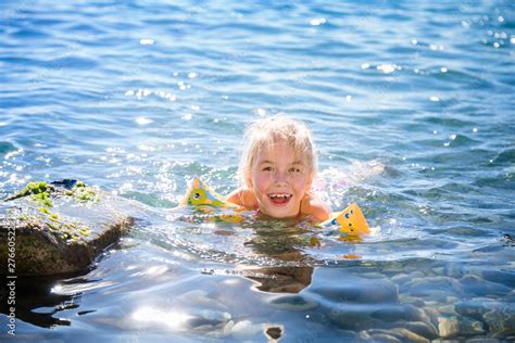 Kids At The Beach Swimming