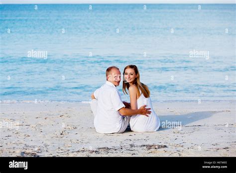 young happy couple in love on the beach Stock Photo - Alamy