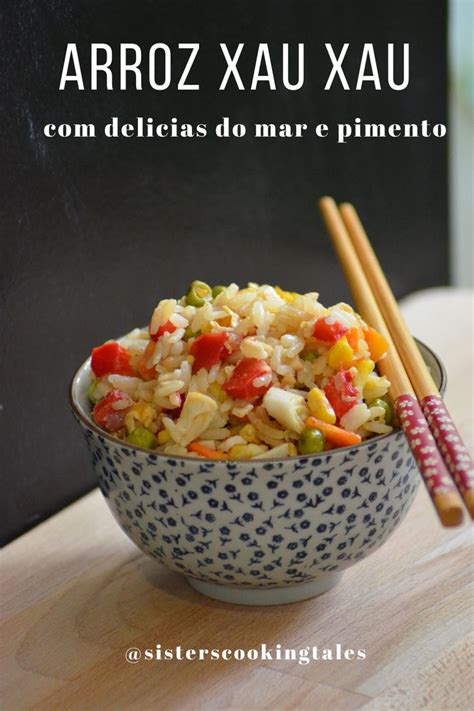 A Bowl Filled With Rice And Vegetables Next To Chopsticks