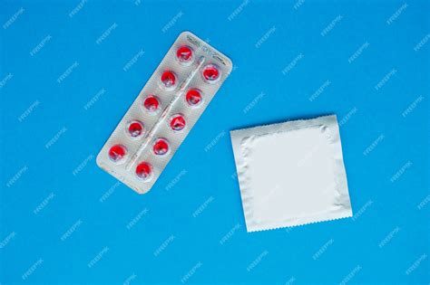 Premium Photo Pills Or Condom Antibiotics From Venereal Diseases Concept Of Safe Sex