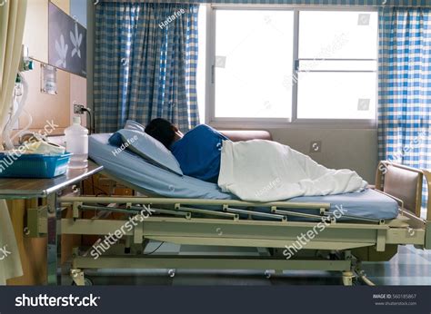 Male Patient Sleeping On Hospital Bed Stock Photo 560185867 | Shutterstock