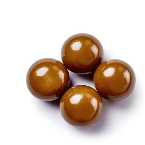 Premium Photo Four Brown Balls Of Chocolate Are Lined Up With One