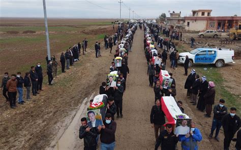 Iraqi Yazidis Hold Burial Ceremony For More Than 100 Killed In 2014 Islamic State Massacre