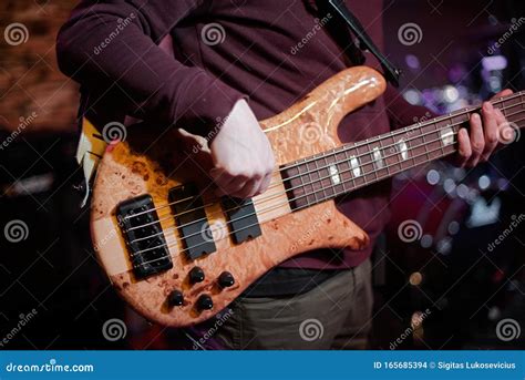 Rock Band Performs On Stage Guitarist Bass Guitar And Drums Stock