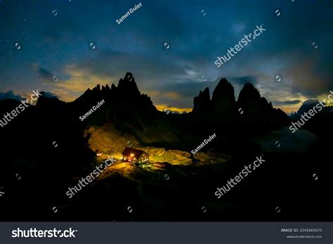 Green Tent Lighted Inside Against Backdrop Stock Photo