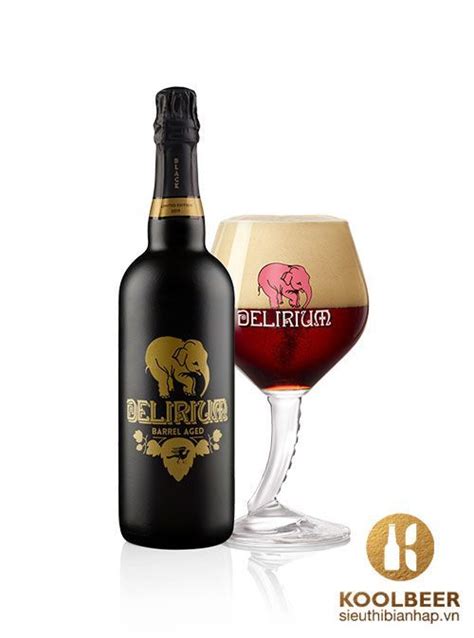 A Bottle Of Beer Next To A Glass Filled With Red Wine And An Elephant