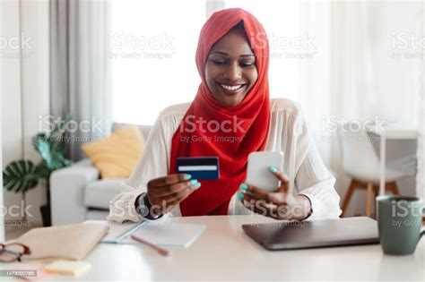 Online Shopping And Epayment Happy Muslim Woman In Hijab Using