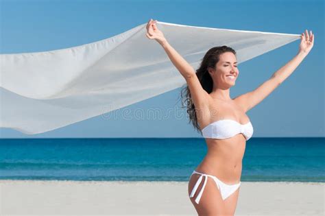Attractive Woman In A Bikini Smiles At The Sun At The Beach Stock Photo Image Of Bikini