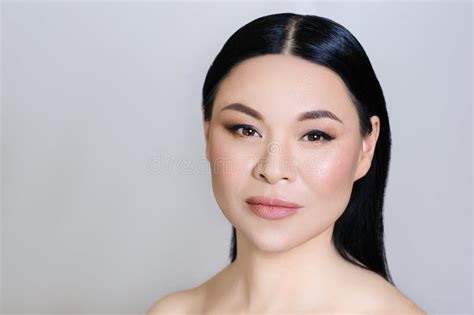 Beautiful Asian Woman Face With Clean Fresh Skin Nude Makeup Cosmetology Healthcare Beauty