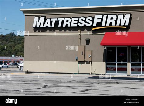 A Logo Sign Outside Of A Mattress Firm Retail Store In Altoona