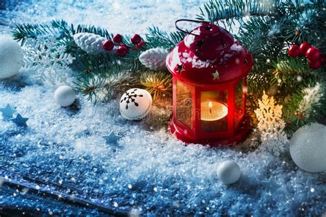 Red Christmas Lantern in Snow with Fir Tree Branch. Winter Cozy Scene